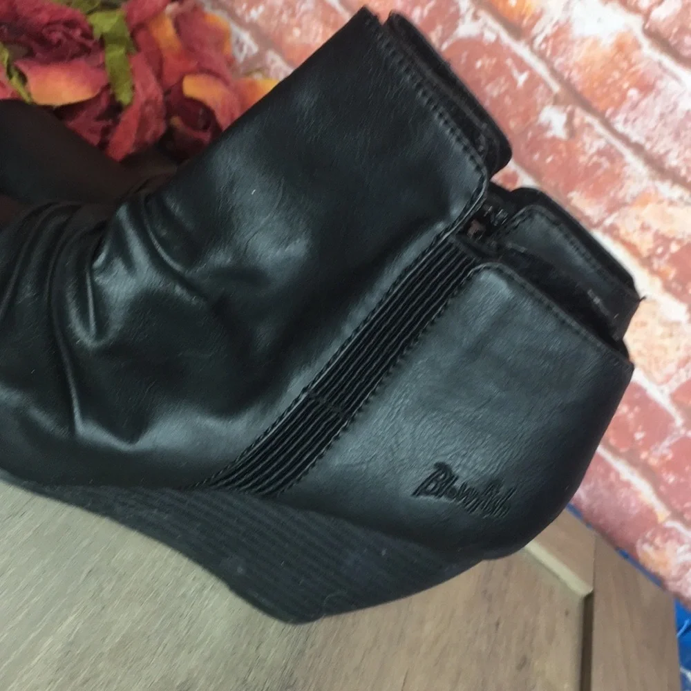 Blowfish’s Malibu Black Slouchy Faux Leather Wedge Ankle Booties